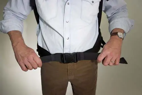 A man holding a Belt Buckle Tighten On The Shoulder